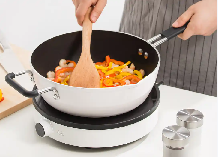 Kitchen scene with color coated aluminum frying pan